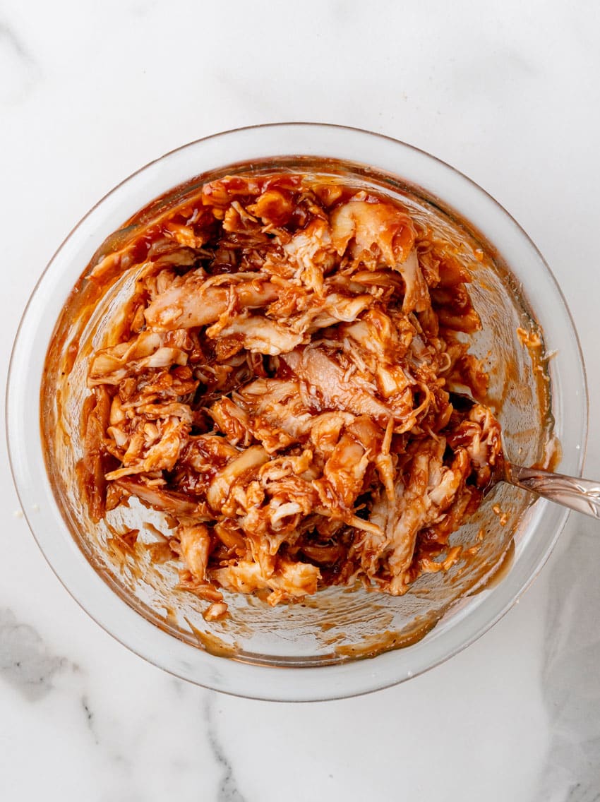 barbecue chicken in a glass mixing bowl