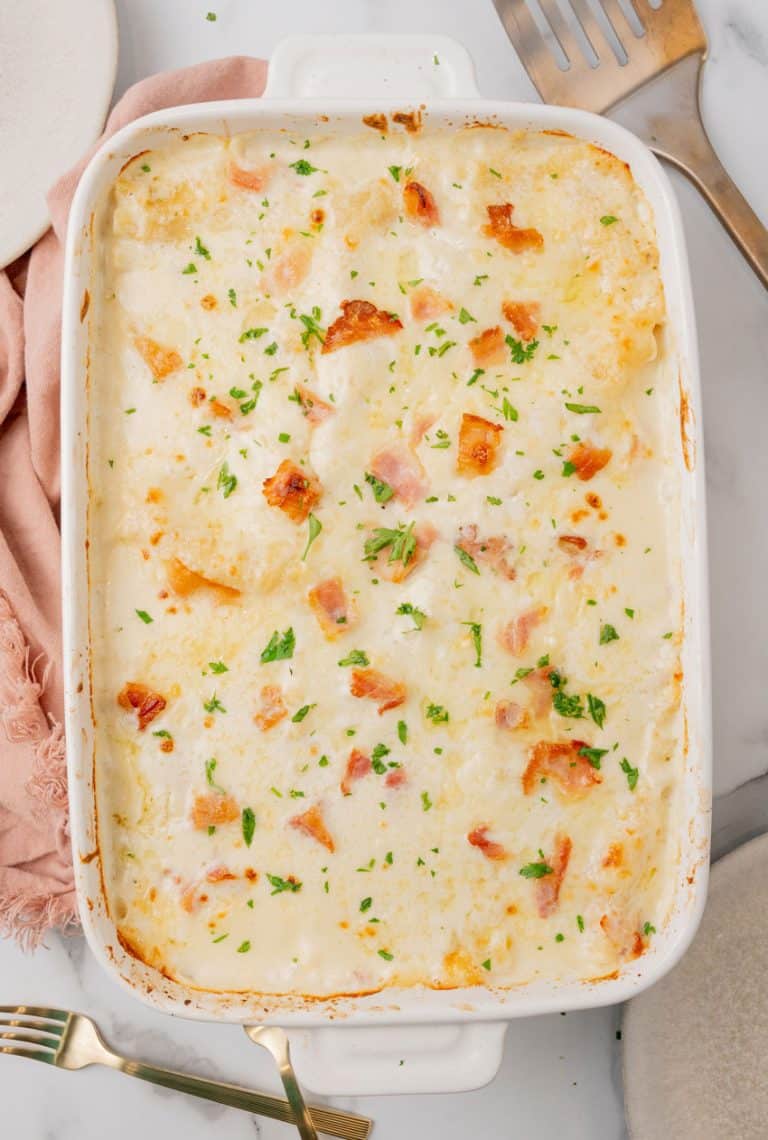 chicken cordon bleu lasagna in a white baking dish