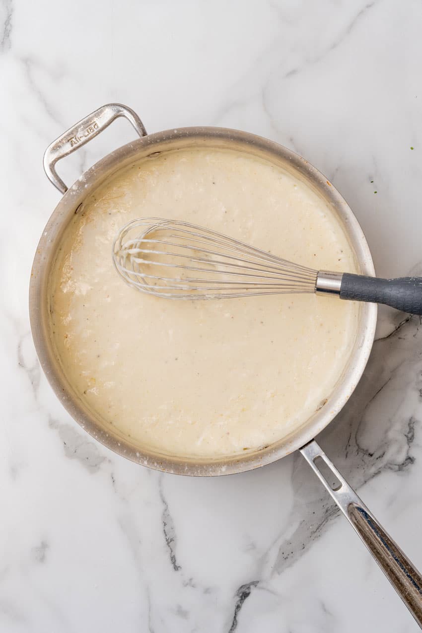homemade white country gravy in a small metal skillet