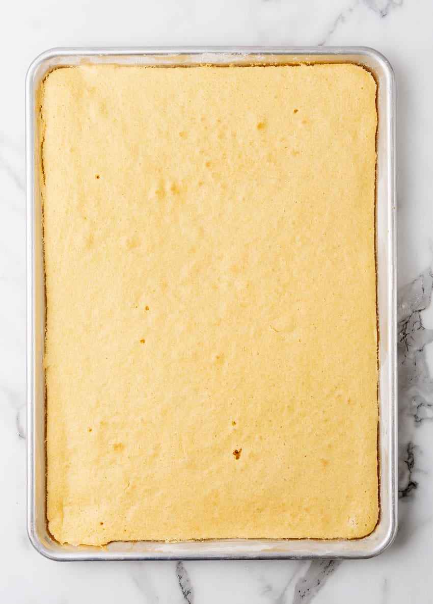 baked yellow sheet cake in a metal baking pan