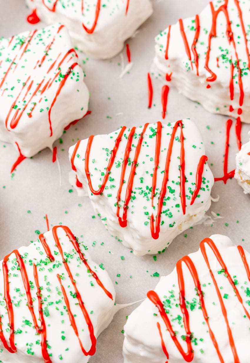 a copycat little debbie christmas tree cake on a parchment paper lined baking sheet pan