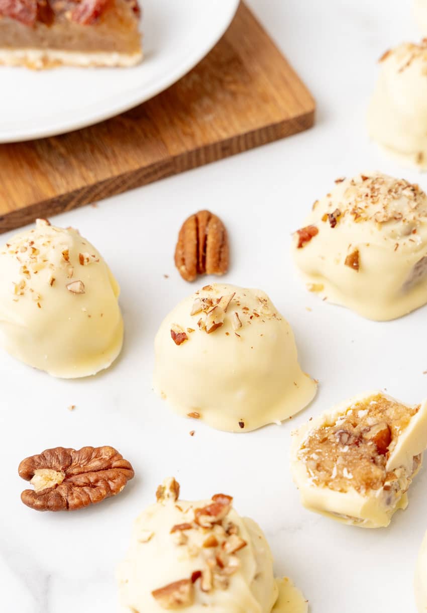 pecan pie truffles on a white counter