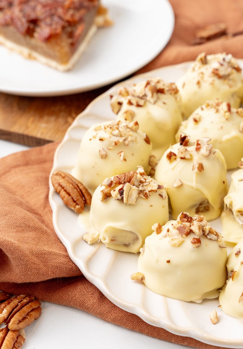 pecan pie truffles on a white serving plate