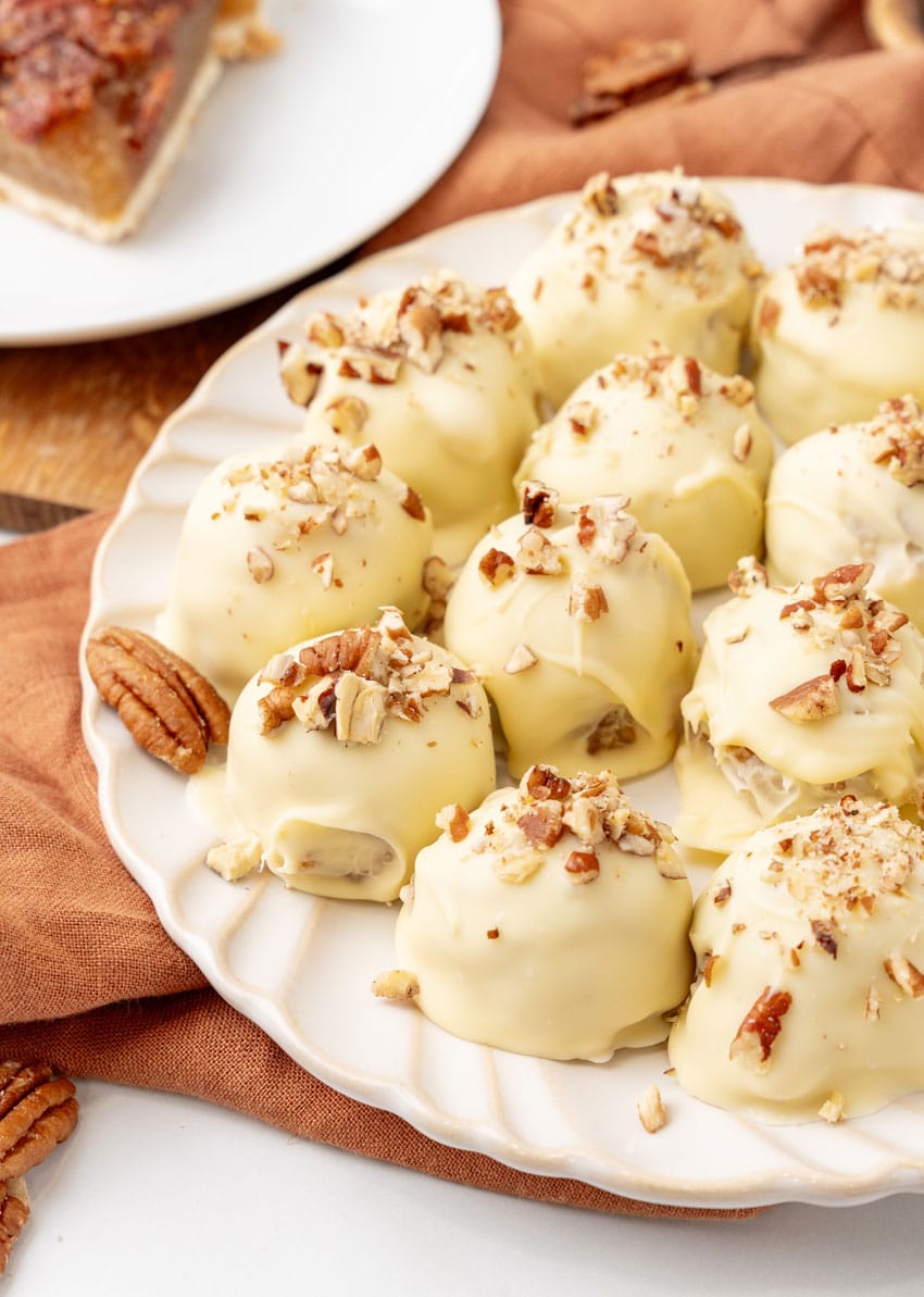 pecan pie truffles on a white serving plate