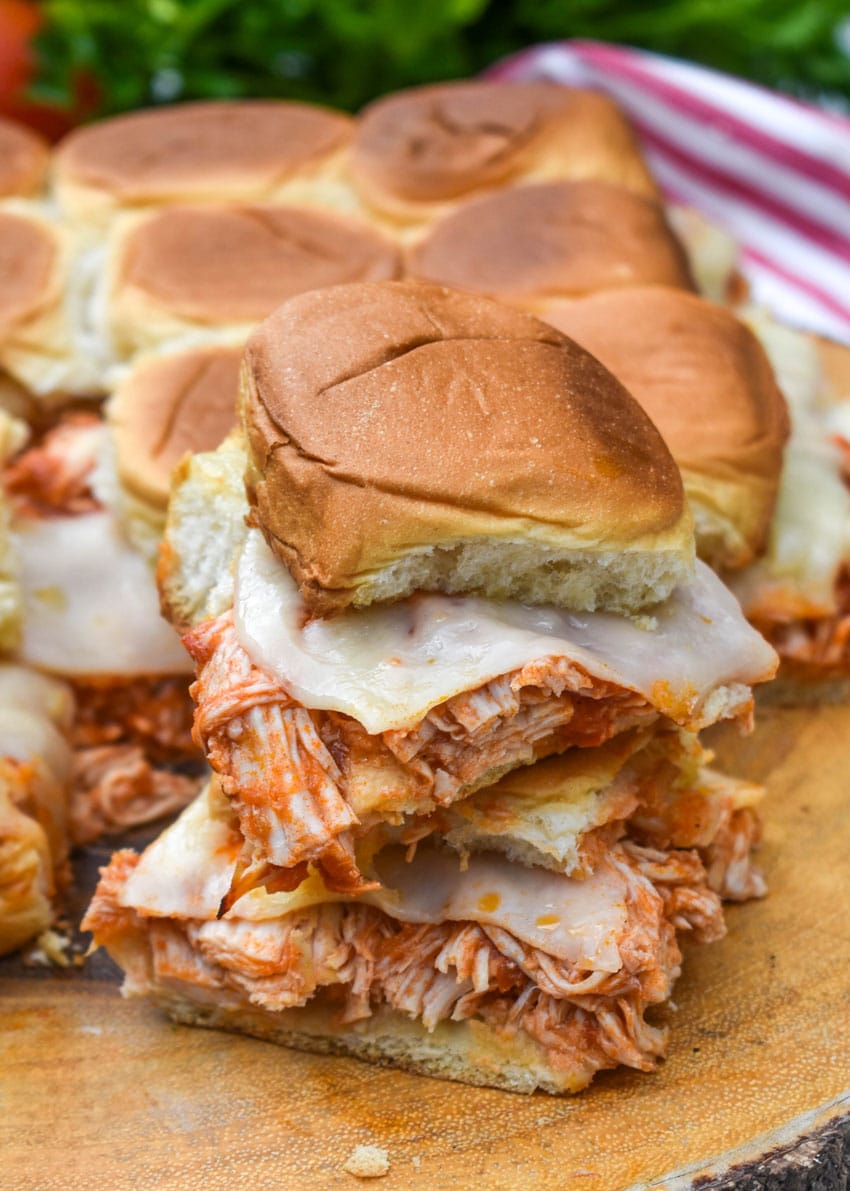 chicken parmesan sliders on a wooden cutting board