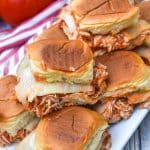 crockpot chicken parmesan sliders stacked on a white serving platter