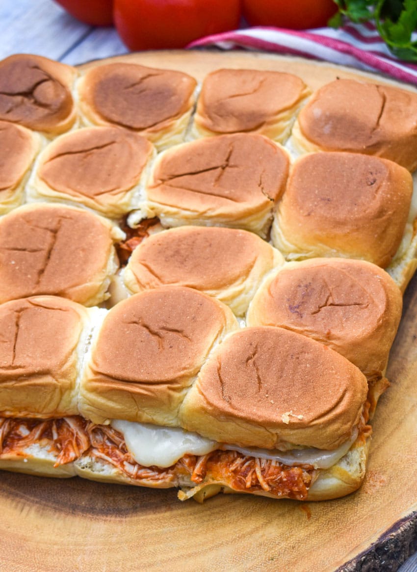 chicken parmesan sliders on a wooden cutting board