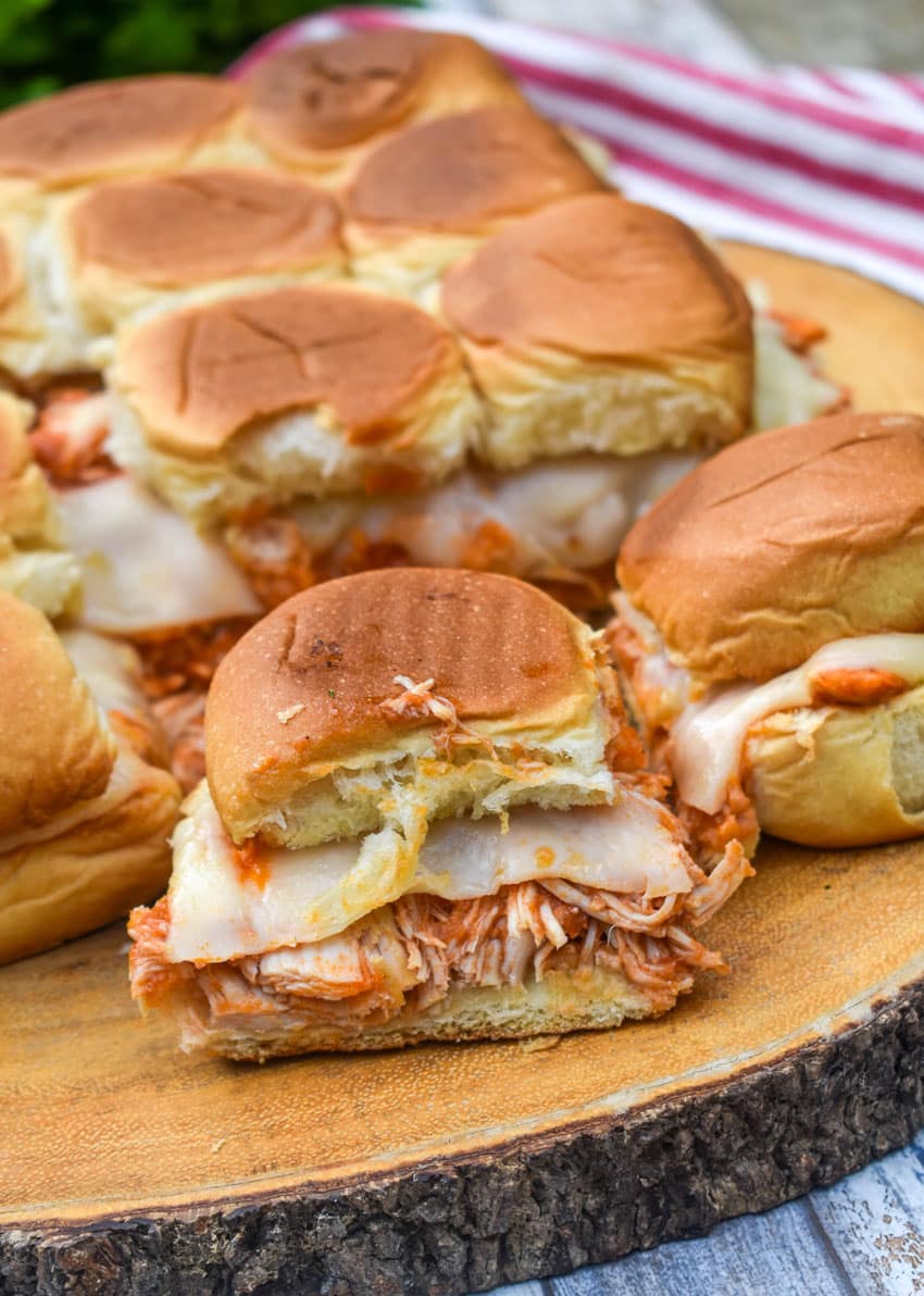 chicken parmesan sliders on a wooden cutting board