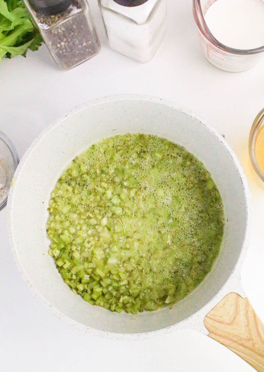 diced celery and melted butter in a small white sauce pot