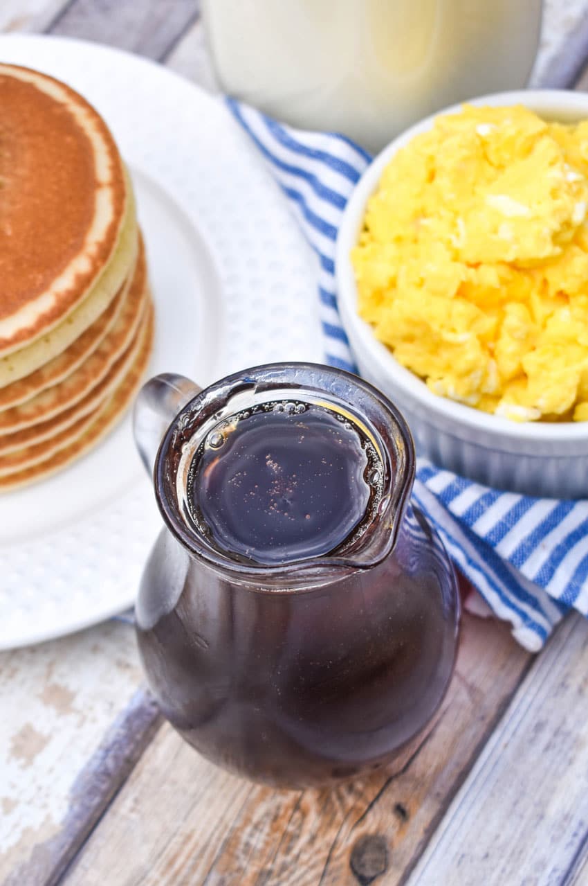 homemade maple syrup in a small glass pitcher