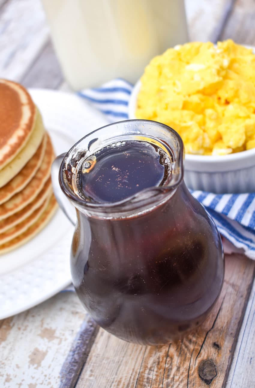 homemade maple syrup in a small glass pitcher