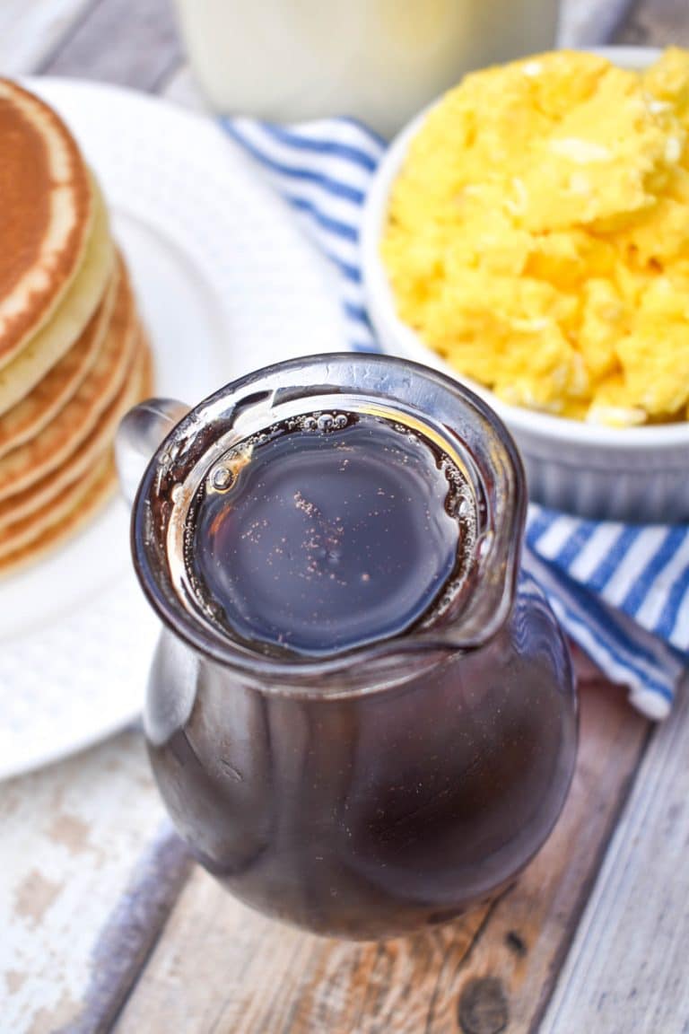 homemade maple syrup in a small glass pitcher