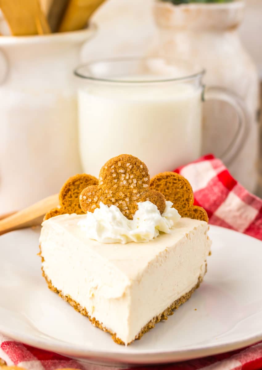 a slice of no bake gingerbread cheesecake on a white plate