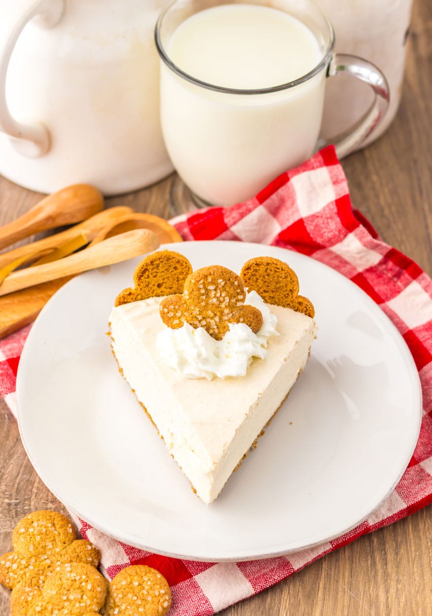 a slice of no bake gingerbread cheesecake on a white plate