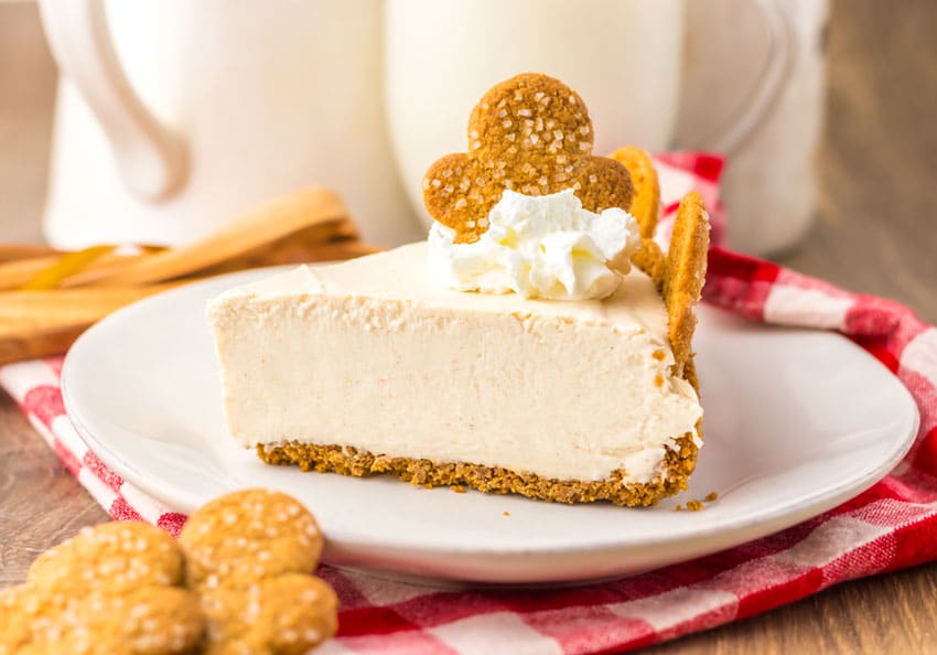 a slice of no bake gingerbread cheesecake on a white plate