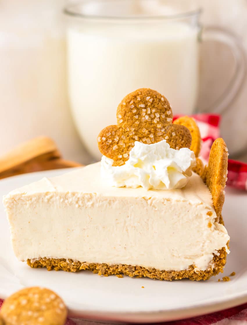 a slice of no bake gingerbread cheesecake on a white plate