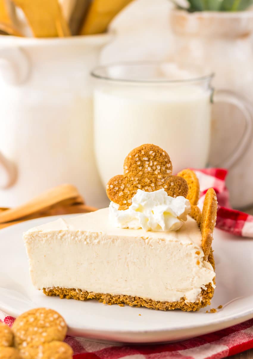 a slice of no bake gingerbread cheesecake on a white plate