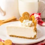 a slice of no bake gingerbread cheesecake on a white plate