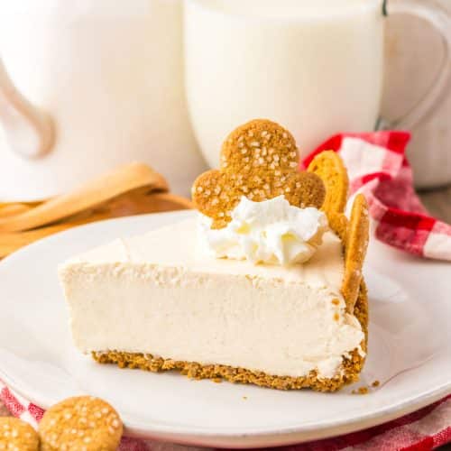 a slice of no bake gingerbread cheesecake on a white plate