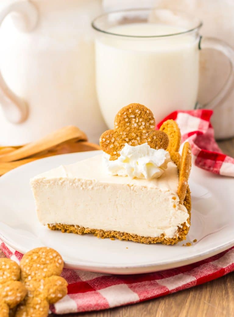 a slice of no bake gingerbread cheesecake on a white plate