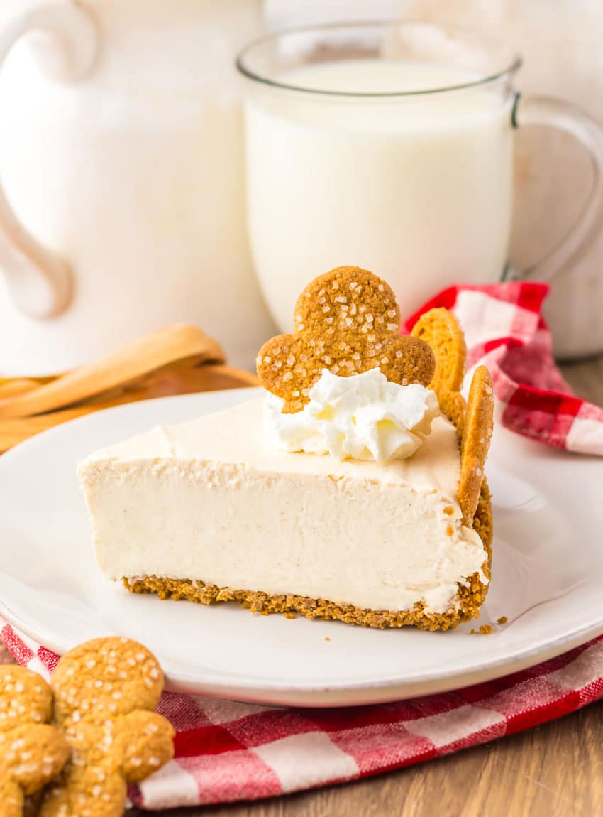 a slice of no bake gingerbread cheesecake on a white plate