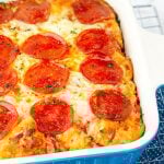 bubble up pizza casserole in a blue baking dish