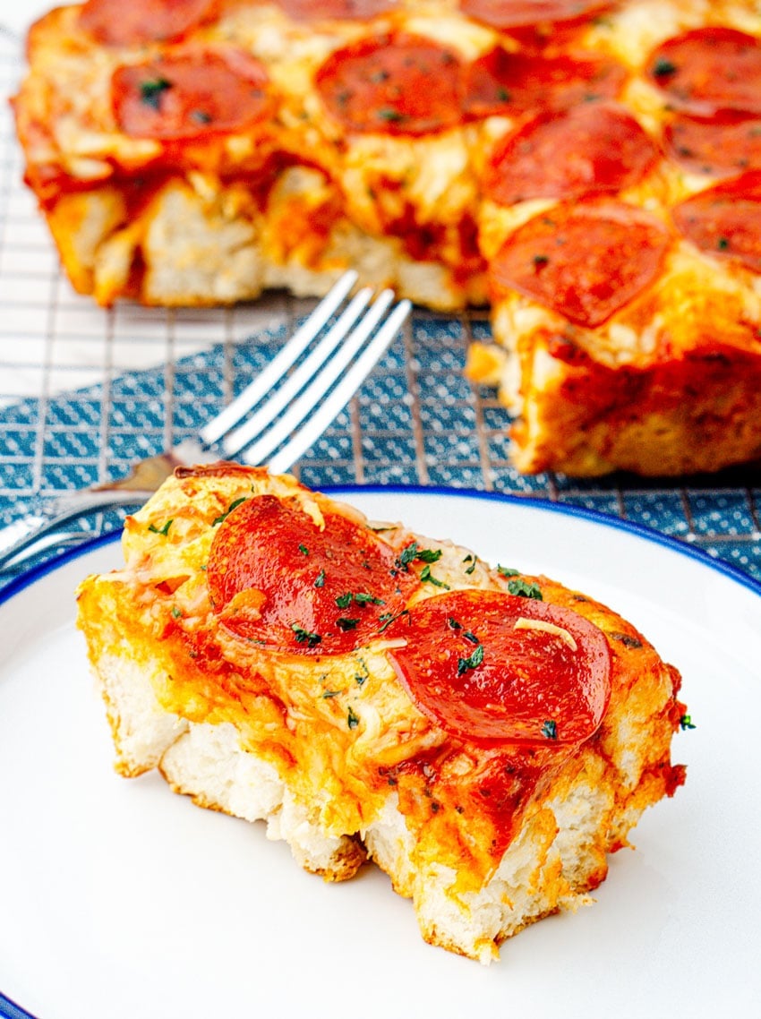 a slice of bubble up pizza casserole on a small white plate