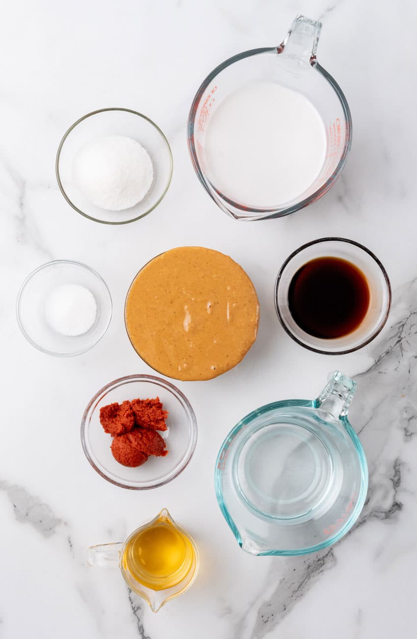 an overhead image showing the measured ingredients needed to make a batch of homemade asian peanut sauce