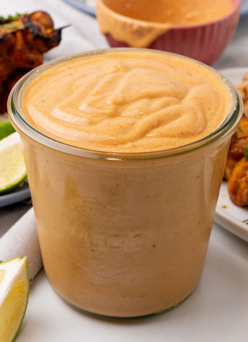 homemade peanut sauce in a small glass jar