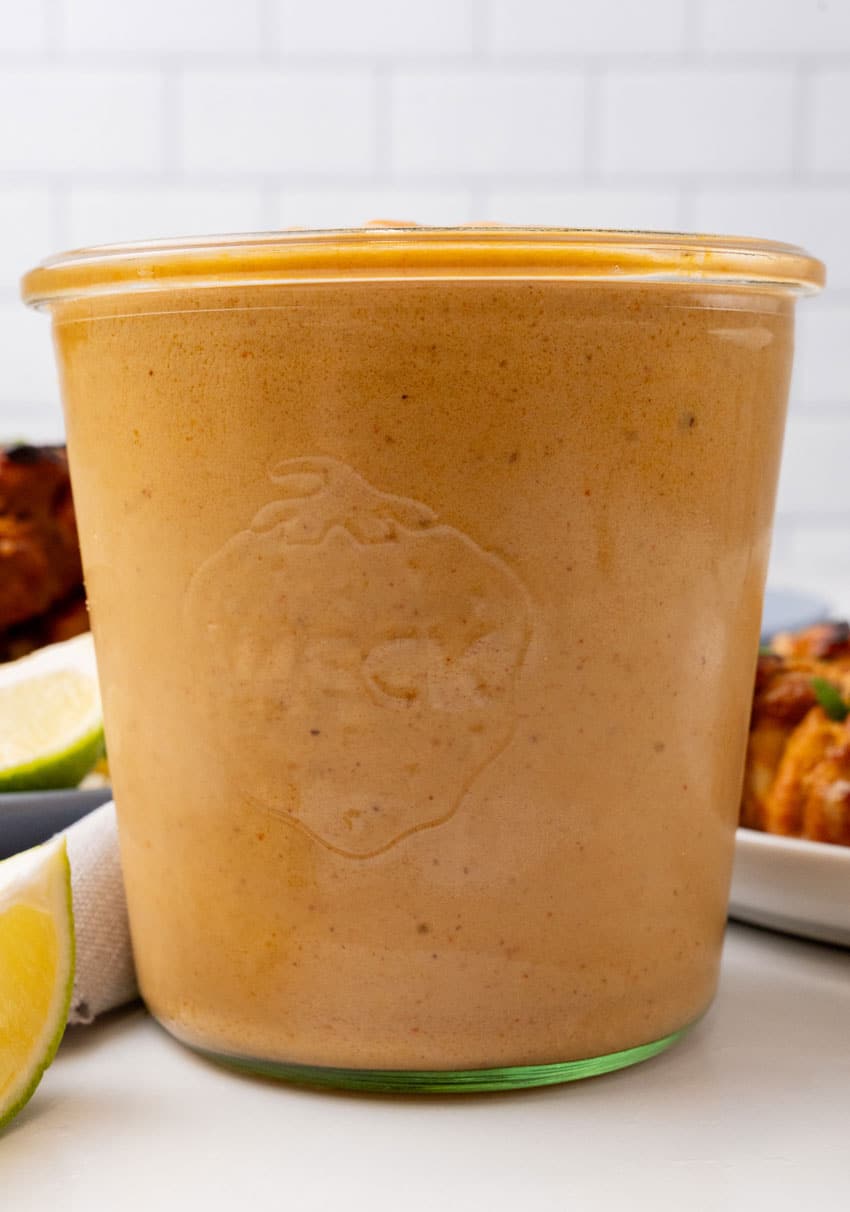 homemade peanut sauce in a small glass jar