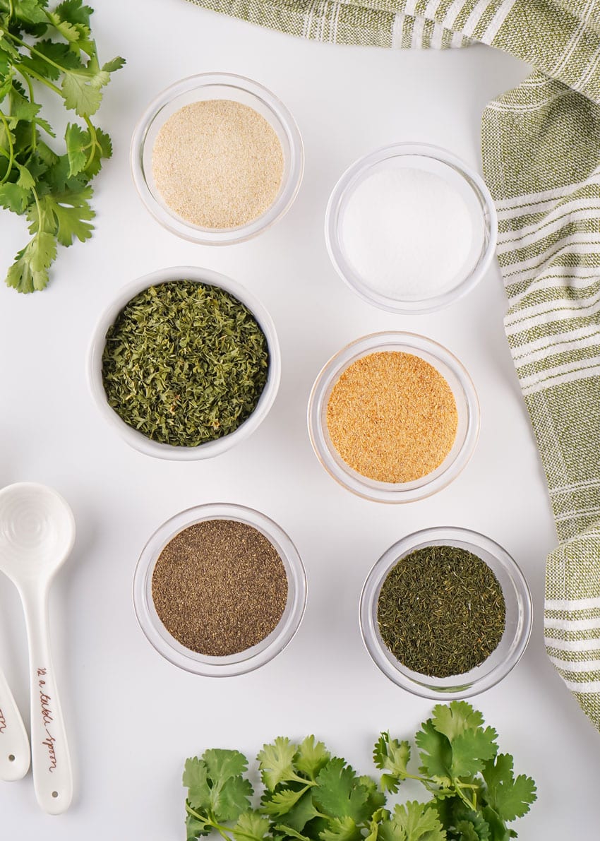 an overhead image showing the measured ingredients needed to make a batch of homemade ranch seasoning mix