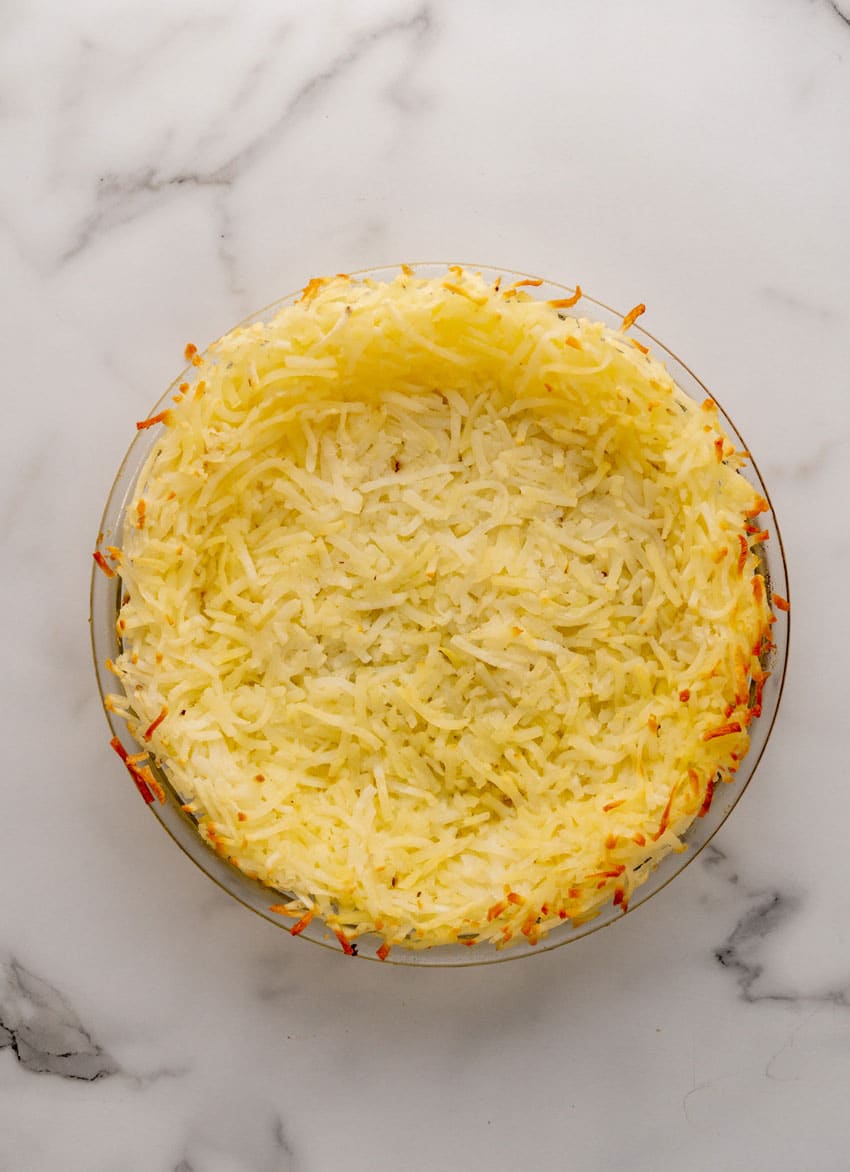 a crispy baked has brown crust in a glass pie plate