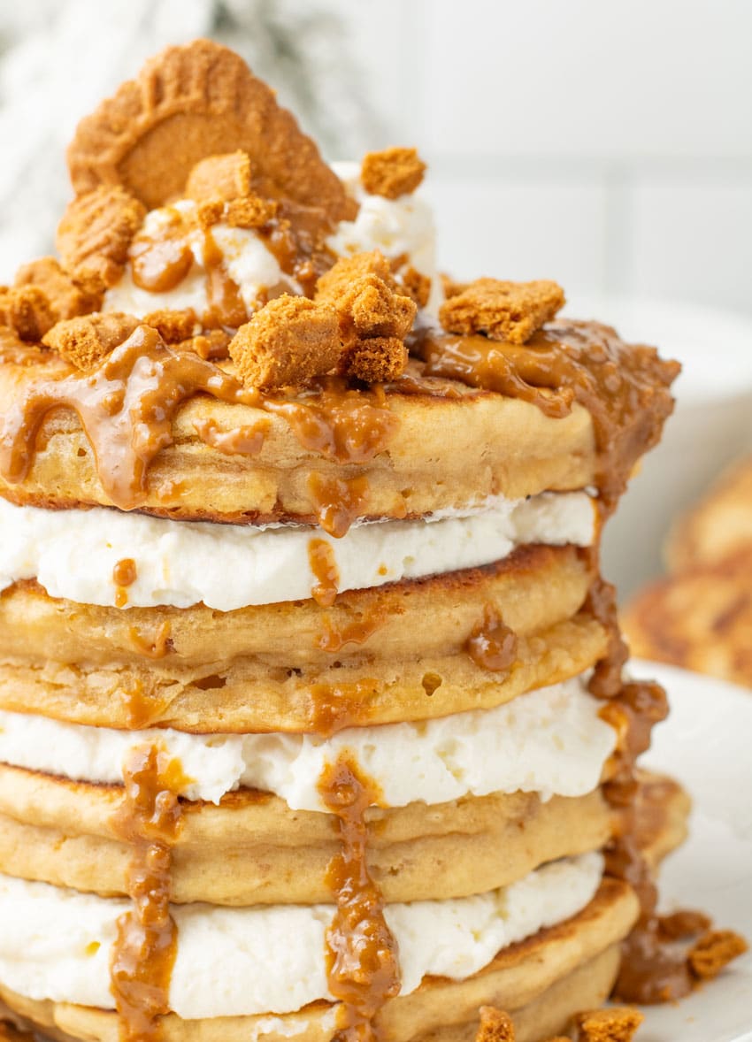 a cookie butter pancake frying in a large cast iron skillet