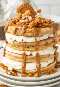 a stack of cookie butter pancakes on a white plate