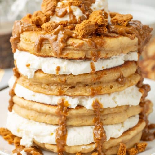 a stack of cookie butter pancakes on a white plate