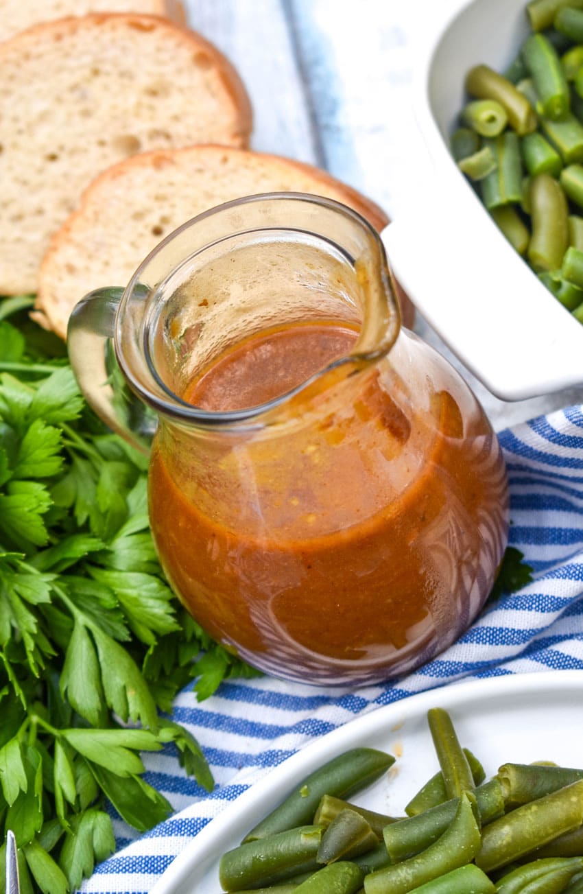 brown pot roast gravy in a small glass jar