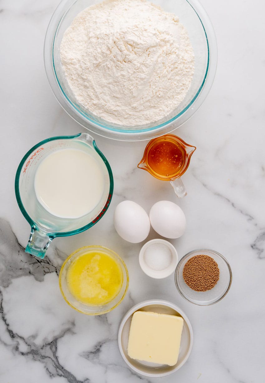 an overhead image showing the measured ingredients needed to make a batch of copycat texas roadhouse rolls