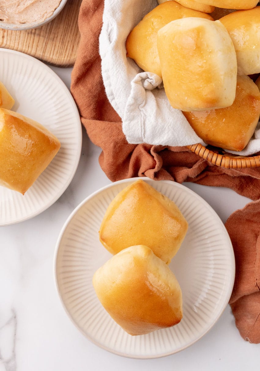 copycat texas roadhouse rolls on a small white appetizer plate