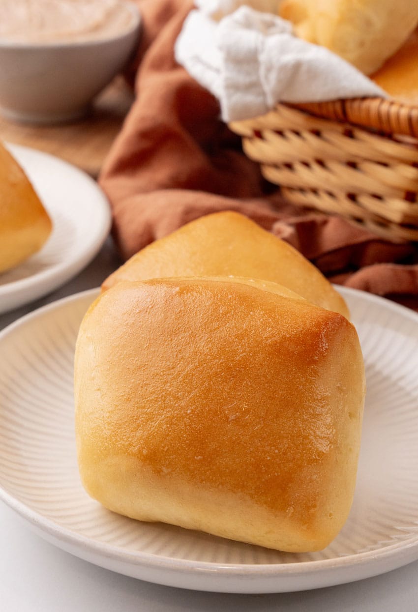 copycat texas roadhouse rolls on a small white appetizer plate