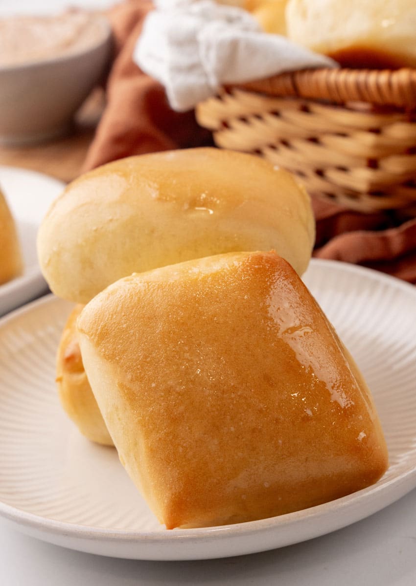 copycat texas roadhouse rolls on a small white appetizer plate