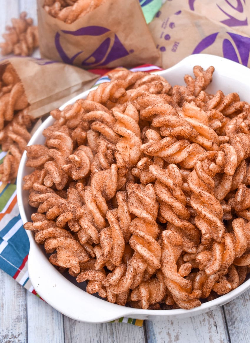 homemade taco bell cinnamon twists in a large white bowl