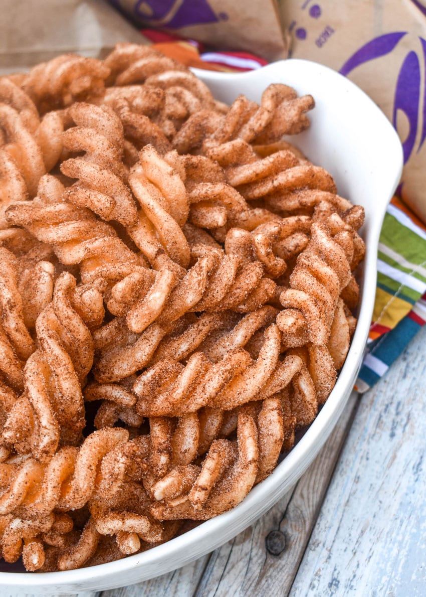 homemade taco bell cinnamon twists in a large white bowl