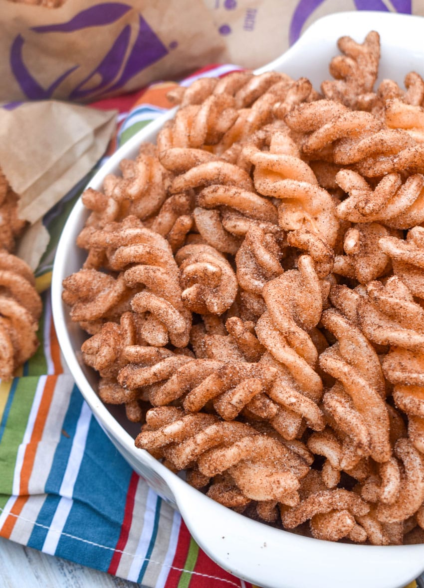 homemade taco bell cinnamon twists in a large white bowl