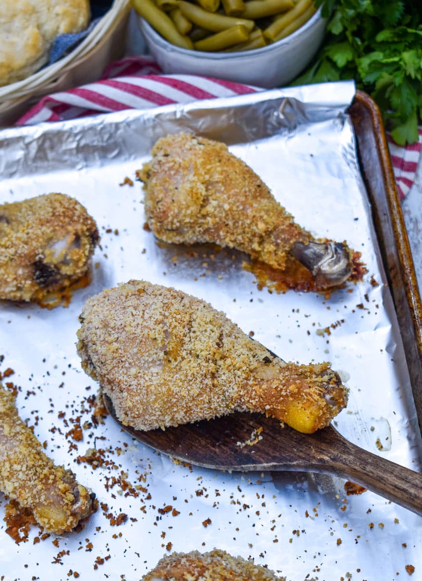 HOMEMADE SHAKE AND BAKE CHICKEN LEGS ON A FOIL LINED BAKING SHEET