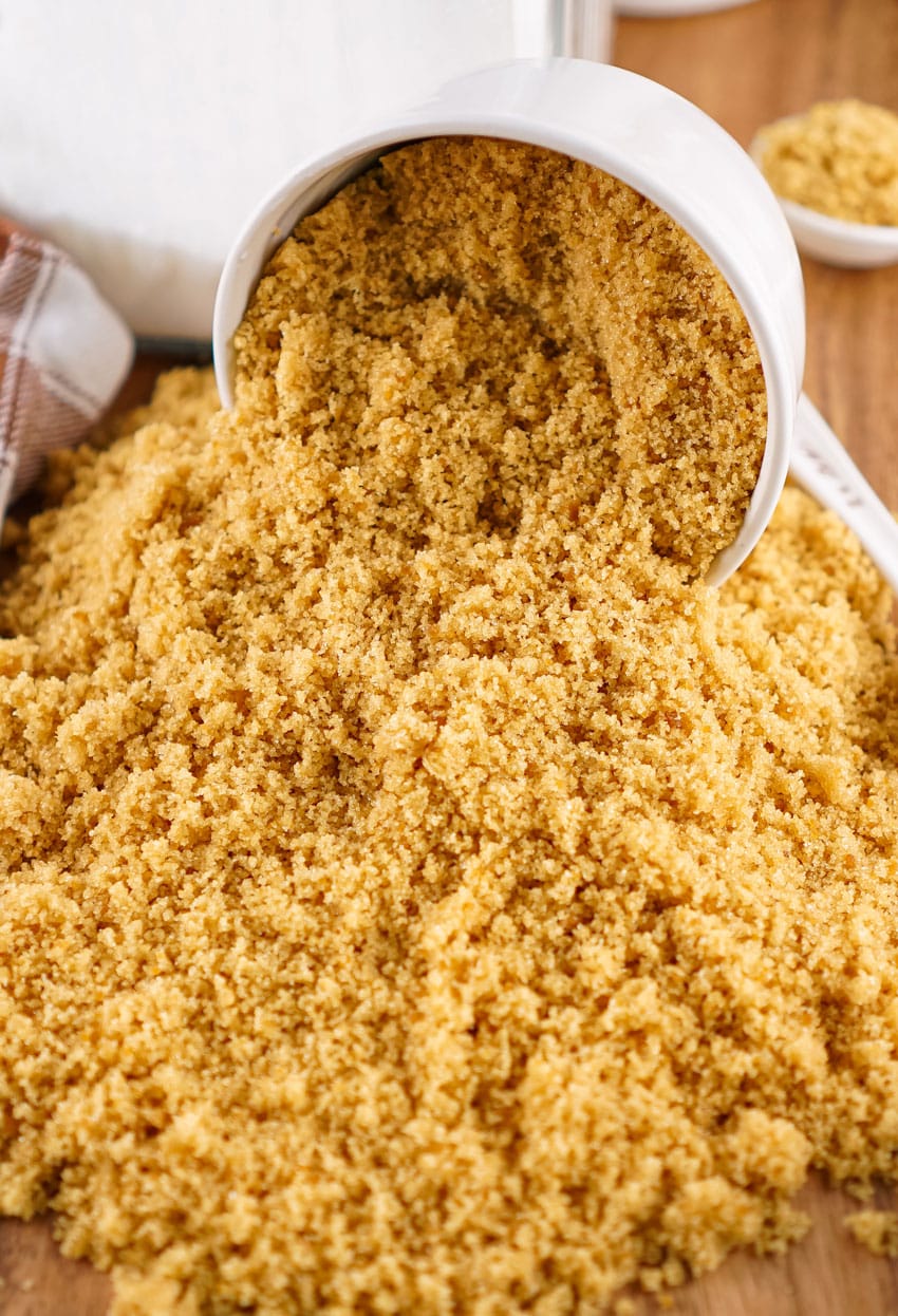 homemade brown sugar spilling out of a small white bowl