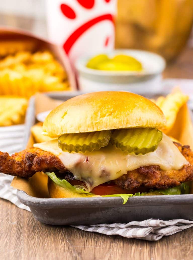 a copycat Chick Fil A spicy deluxe sandwich on a metal tray