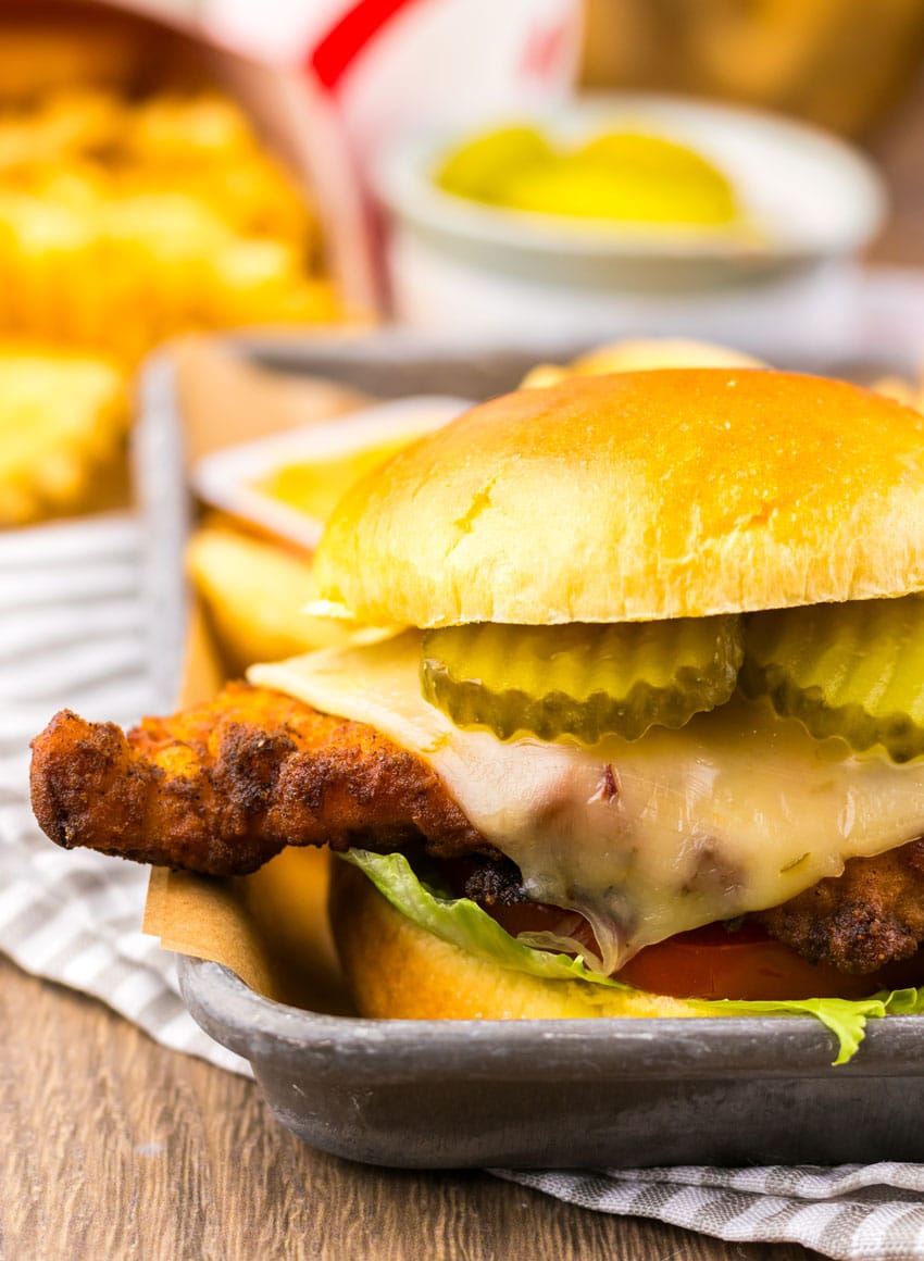 a copycat Chick Fil A spicy deluxe sandwich on a metal tray