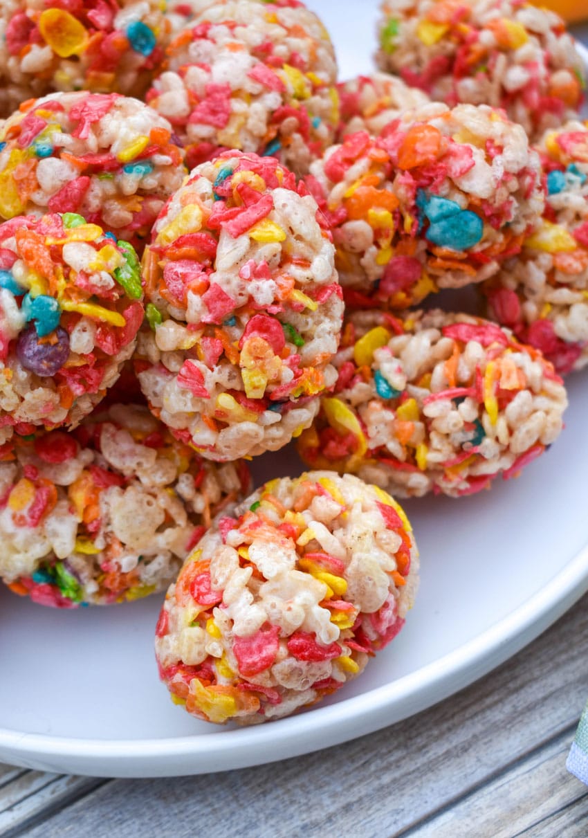 a close up of a pile of Rice Krispie Treats Easter Eggs on a white plate