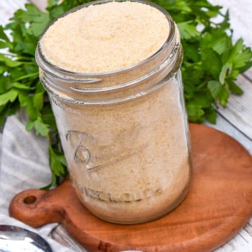 homemade bread crumbs in a glass mason jar sitting on a small wooden trivet