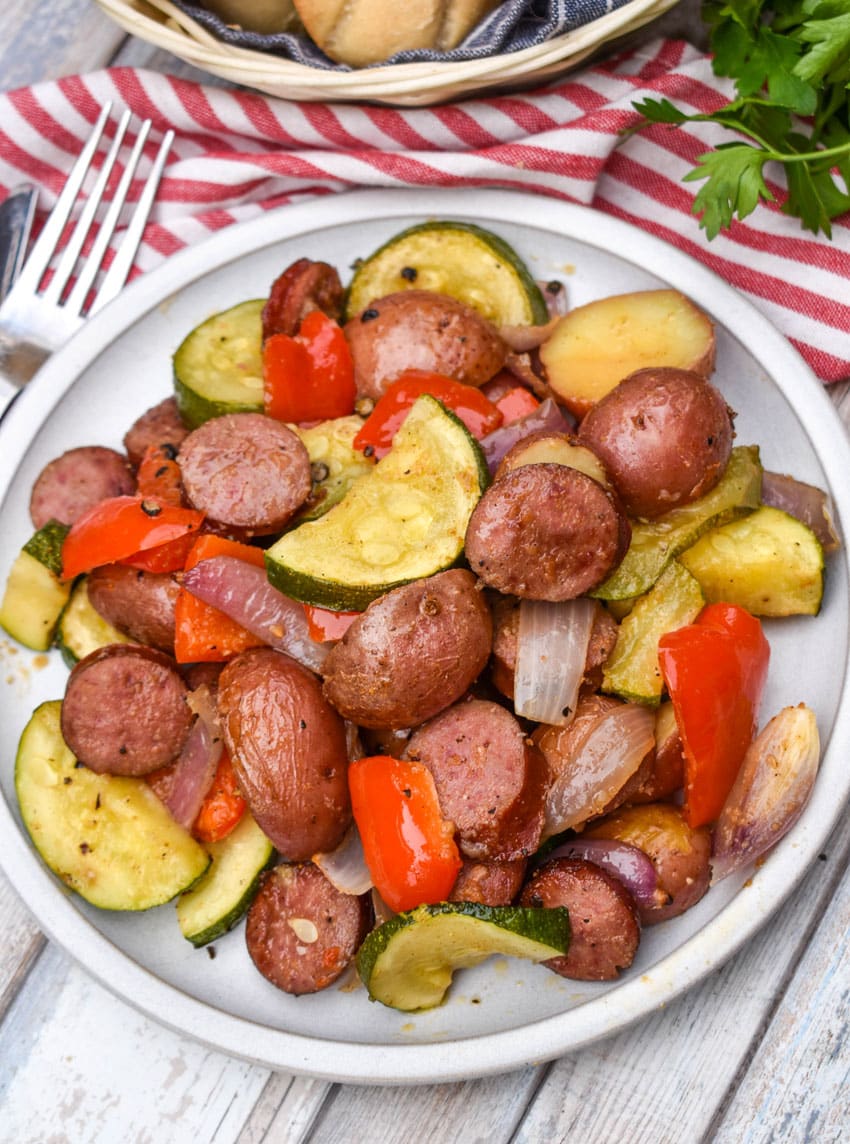 kielbasa sheet pan meal served on a white plate